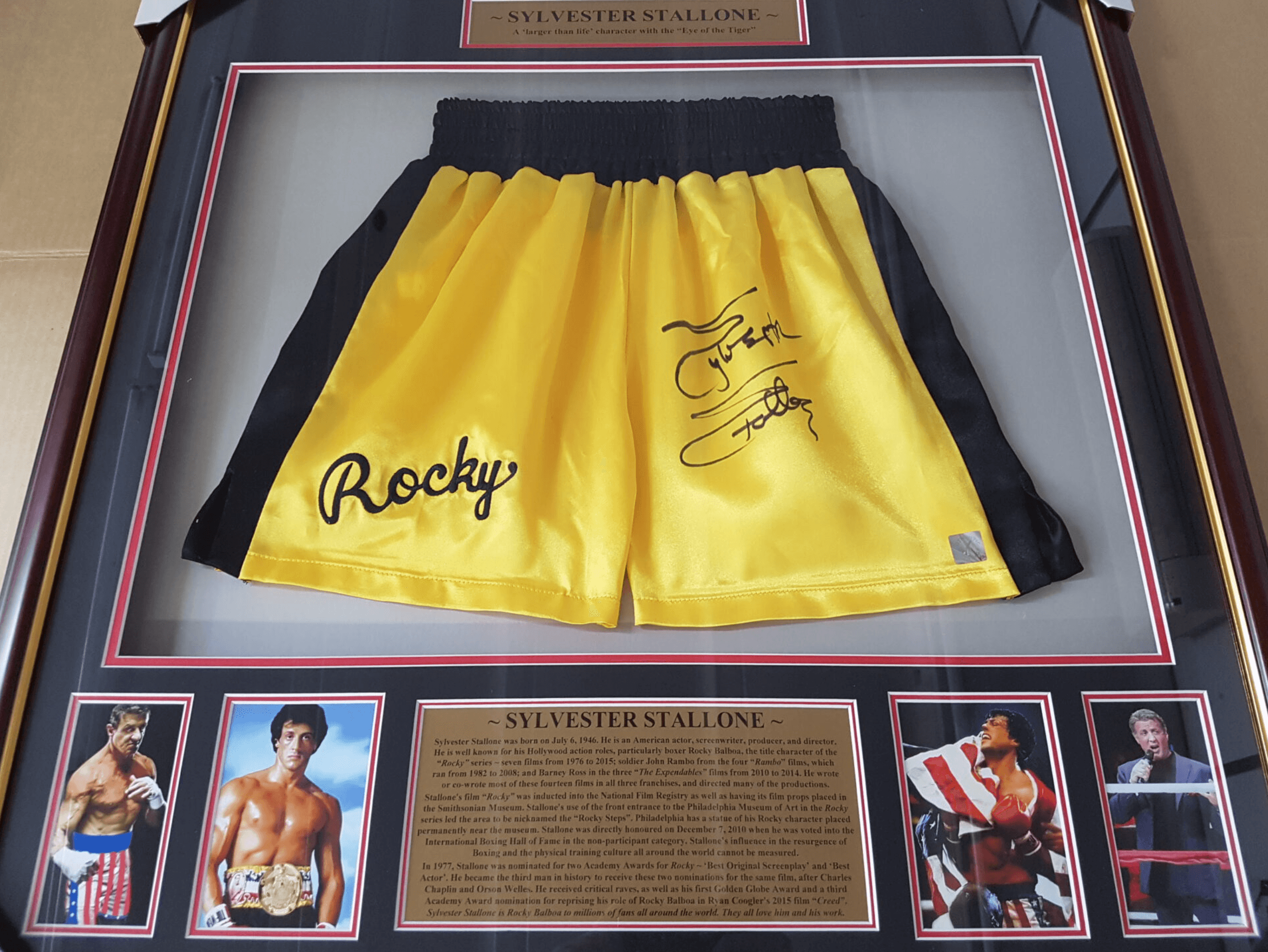 Copy of Sylvester Stallone Autographed “Rocky” Boxing Trunks – Framed Display